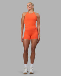 Woman wearing Elixir Ultra High-Rise 4" Short - Ultra Orange | Model:Katie | Size:S | Thumbnail Index: 1