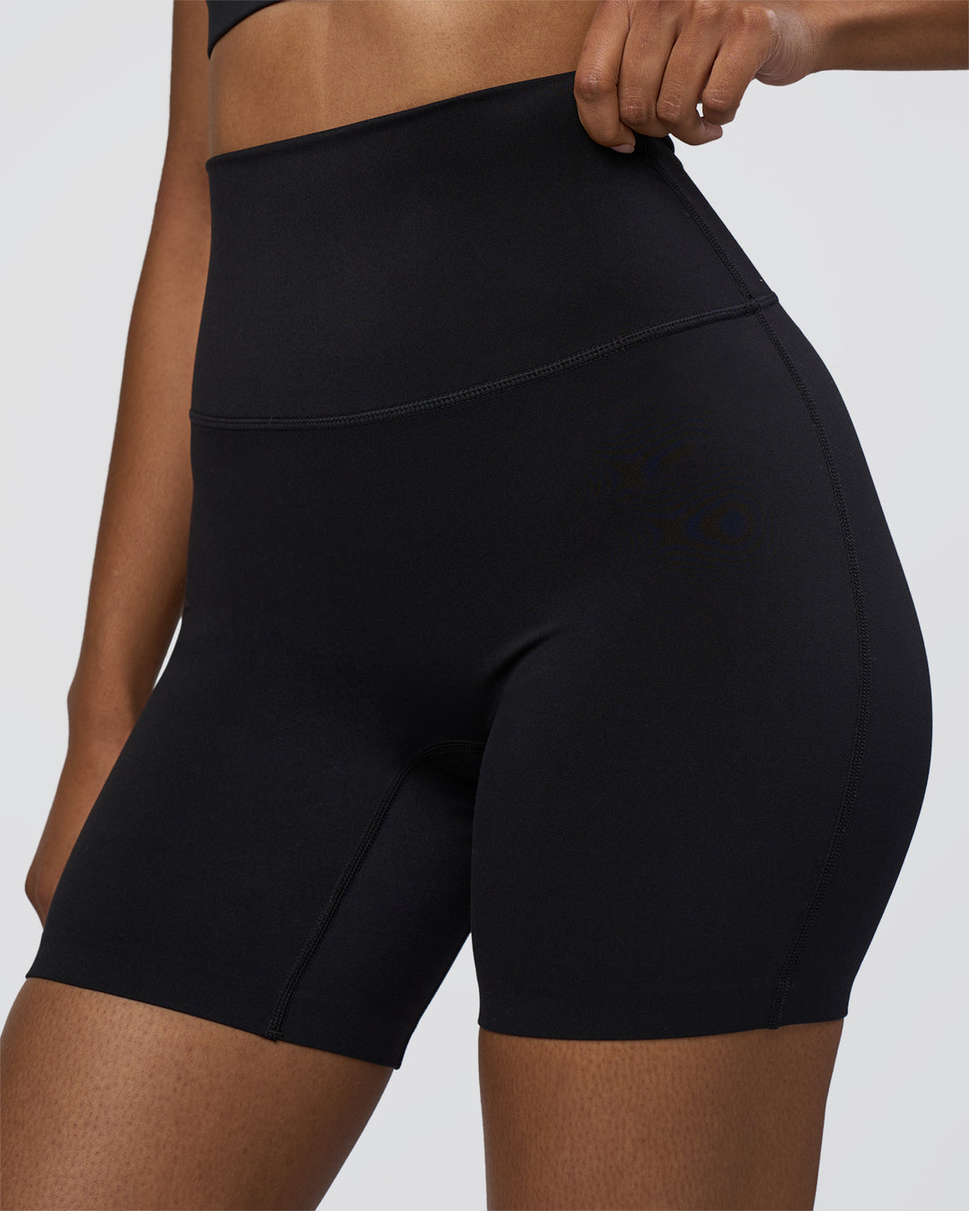 Woman wearing Elixir Ultra High-Rise 6" Short - Black | Model:Jordan | Size:S - view 3