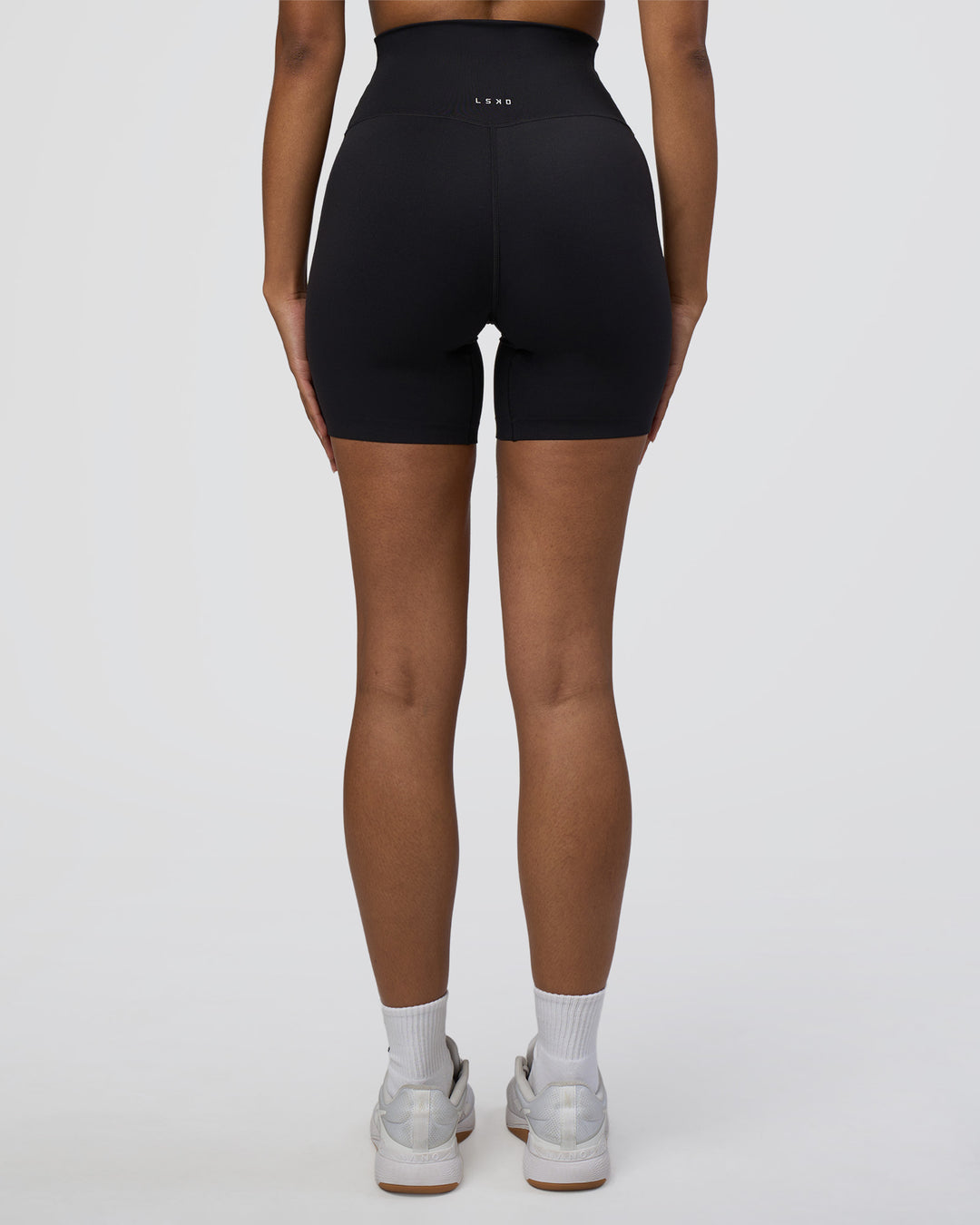 Woman wearing Elixir Ultra High-Rise 6" Short - Black | Model:Jordan | Size:S - view 4