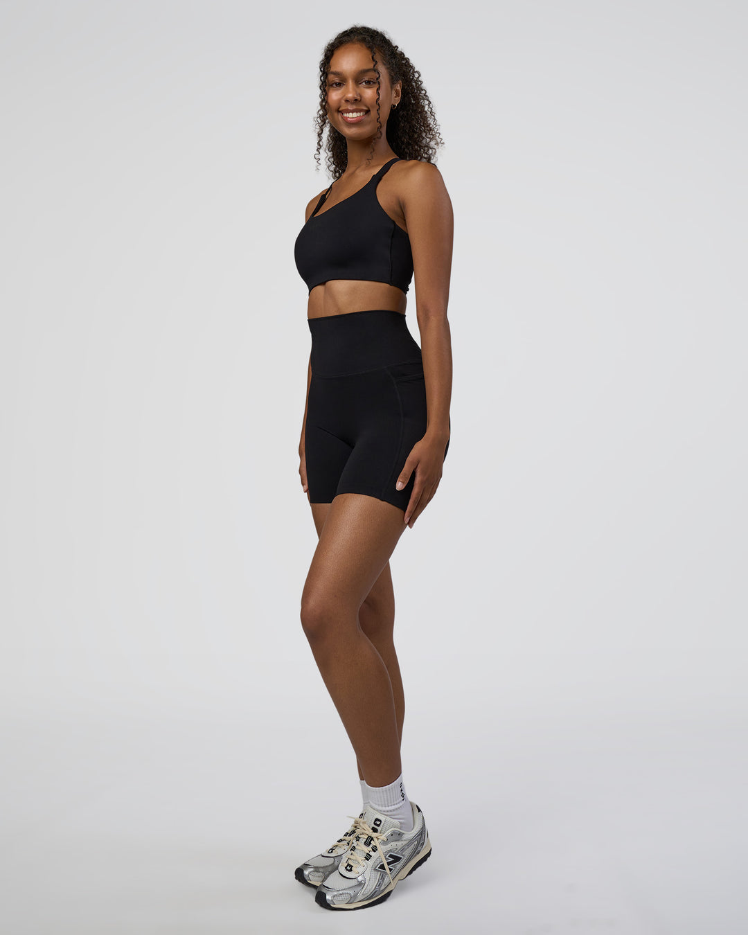 Woman wearing Elixir Ultra High-Rise 6" Short Pockets - Black | Model:Jordan | Size:S - view 5