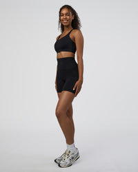 Woman wearing Elixir Ultra High-Rise 6" Short Pockets - Black | Model:Jordan | Size:S | Thumbnail Index: 4