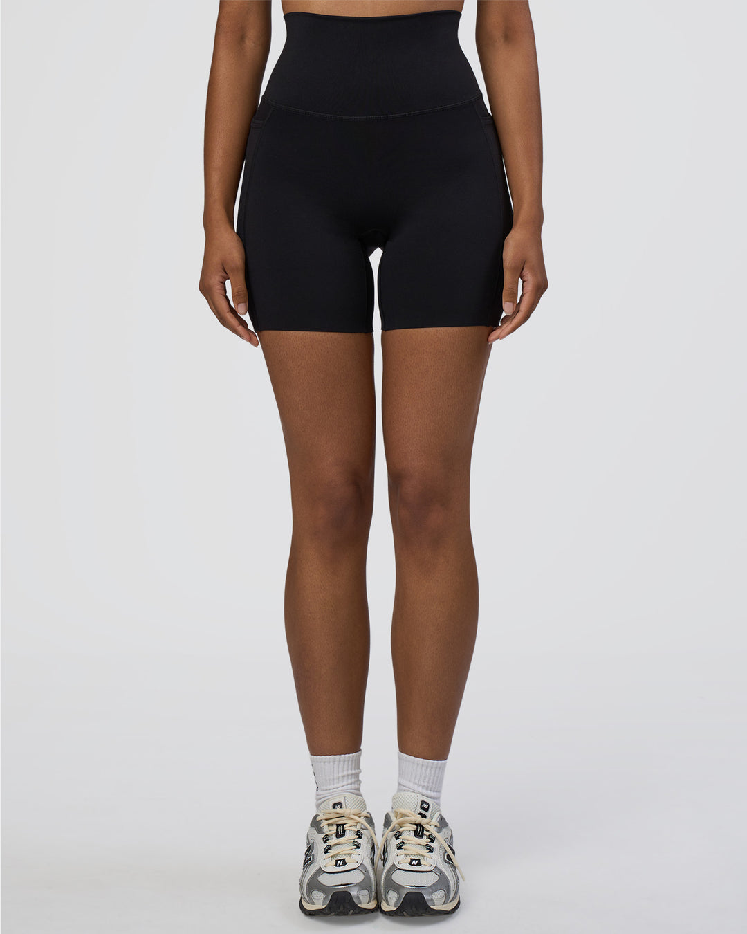 Woman wearing Elixir Ultra High-Rise 6" Short Pockets - Black | Model:Jordan | Size:S - view 7