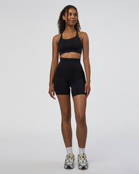 Woman wearing Elixir Ultra High-Rise 6" Short Pockets - Black | Model:Jordan | Size:S | Thumbnail Index: 1