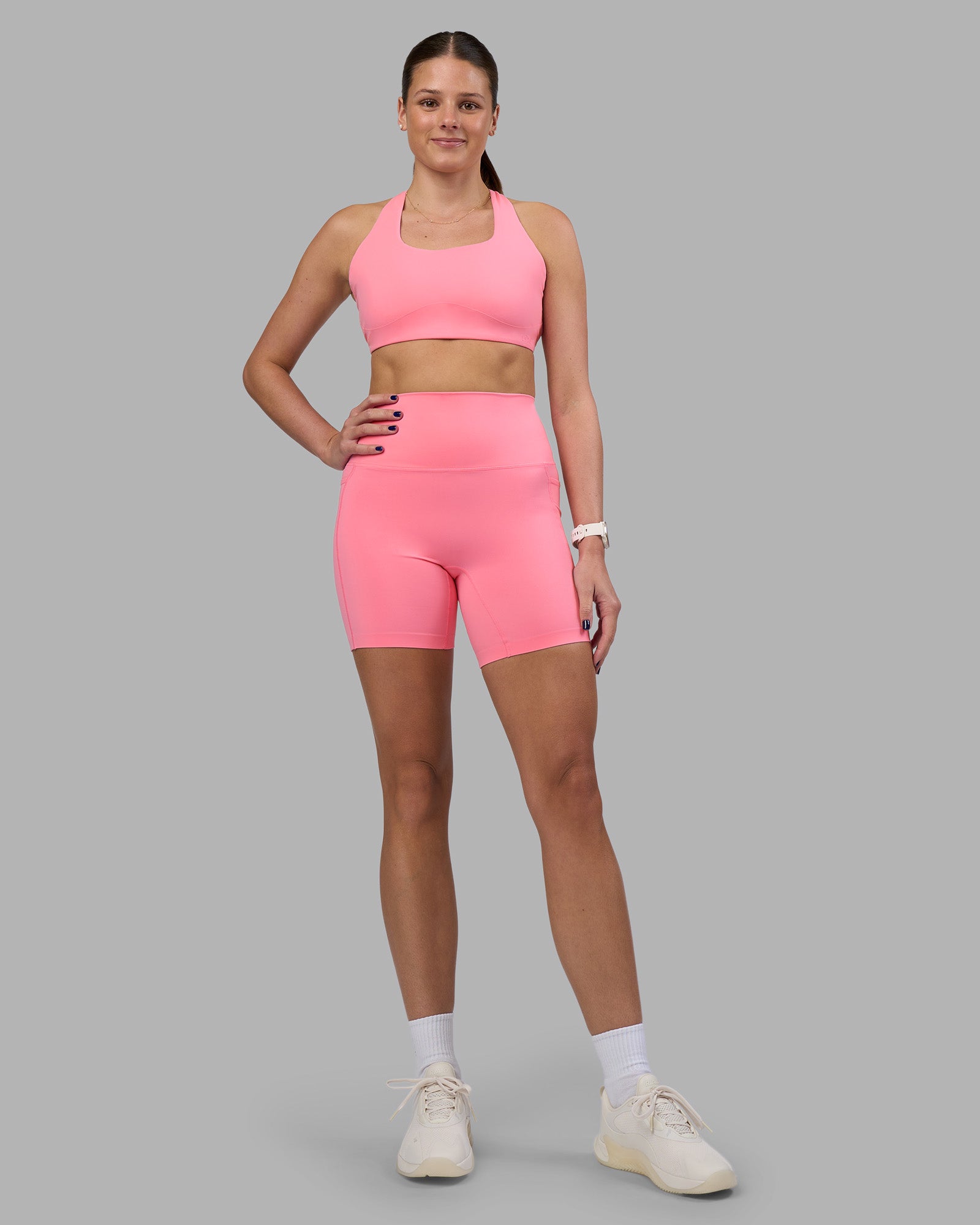 Woman wearing Elixir Ultra High-Rise 6" Short Pockets - Candy Pink | Model:Phoebe | Size:S