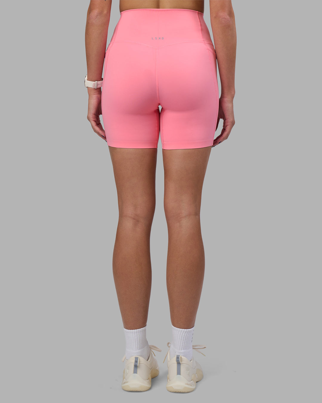 Woman wearing Elixir Ultra High-Rise 6" Short Pockets - Candy Pink | Model:Phoebe | Size:S - view 4