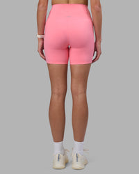 Woman wearing Elixir Ultra High-Rise 6" Short Pockets - Candy Pink | Model:Phoebe | Size:S | Thumbnail Index: 3