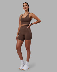 Woman wearing Elixir Ultra High-Rise 6" Short Pockets - Chocolate Martini | Model:Rhiley | Size:S | Thumbnail Index: 11