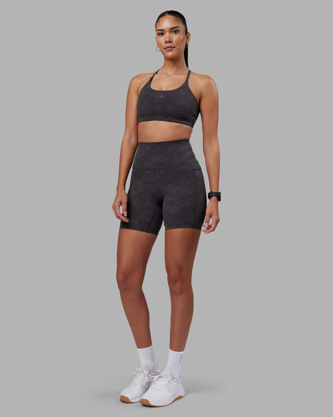 Woman wearing Elixir Ultra High-Rise 6" Short Pockets - Dark Storm Wash | Model:Rhiley | Size:S - view 2