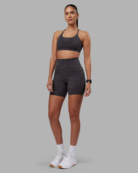Woman wearing Elixir Ultra High-Rise 6" Short Pockets - Dark Storm Wash | Model:Rhiley | Size:S | Thumbnail Index: 1