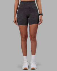 Woman wearing Elixir Ultra High-Rise 6" Short Pockets - Dark Storm Wash | Model:Rhiley | Size:S | Thumbnail Index: 2