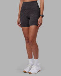 Woman wearing Elixir Ultra High-Rise 6" Short Pockets - Dark Storm Wash | Model:Rhiley | Size:S | Thumbnail Index: 6