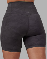 Woman wearing Elixir Ultra High-Rise 6" Short Pockets - Dark Storm Wash | Model:Rhiley | Size:S | Thumbnail Index: 7