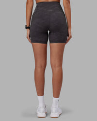 Woman wearing Elixir Ultra High-Rise 6" Short Pockets - Dark Storm Wash | Model:Rhiley | Size:S | Thumbnail Index: 3