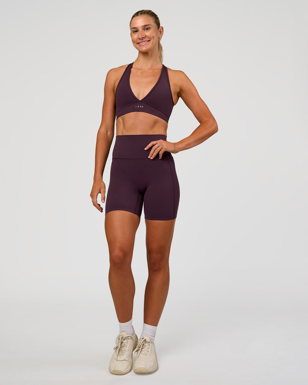 Woman wearing Elixir Ultra High-Rise 6” Short Pockets - Midnight Plum | Model:Emelia | Size:S - view 8