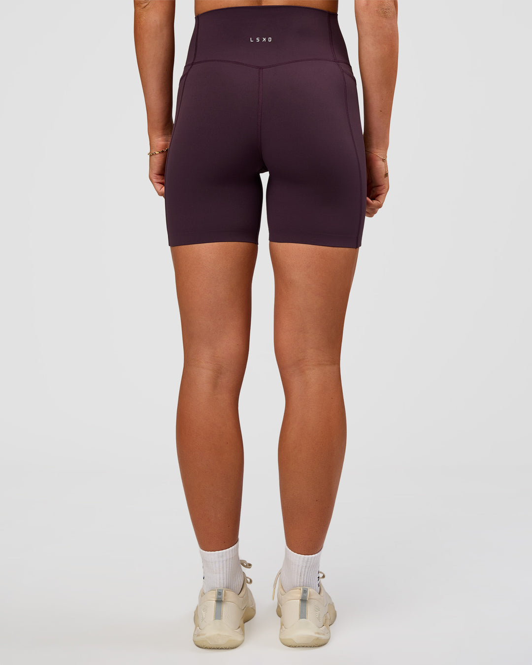 Woman wearing Elixir Ultra High-Rise 6” Short Pockets - Midnight Plum | Model:Emelia | Size:S - view 5