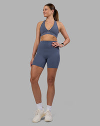 Woman wearing Elixir Ultra High-Rise 6" Short Pockets - Night Shadow | Model:Phoebe | Size:S | Thumbnail Index: 1