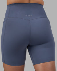 Woman wearing Elixir Ultra High-Rise 6" Short Pockets - Night Shadow | Model:Phoebe | Size:S | Thumbnail Index: 7