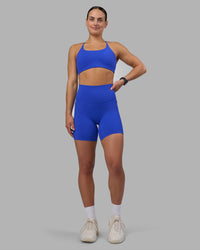 Woman wearing Elixir Ultra High-Rise 6" Short Pockets - Power Cobalt | Model:Keisha | Size:S | Thumbnail Index: 2