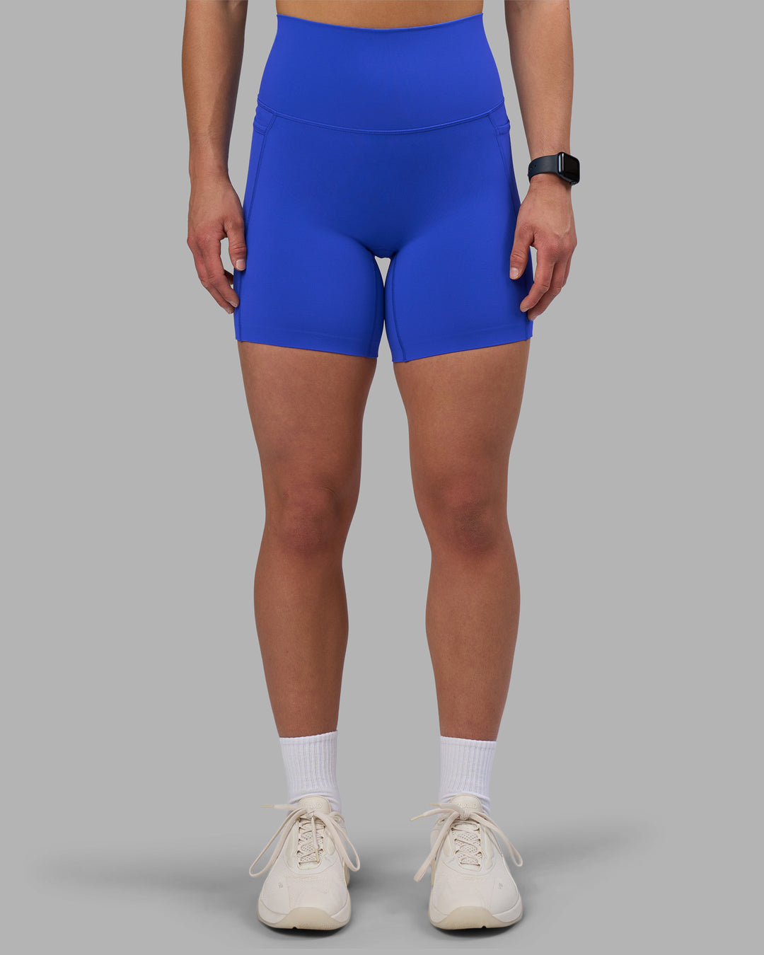 Woman wearing Elixir Ultra High-Rise 6" Short Pockets - Power Cobalt | Model:Keisha | Size:S - view 1