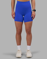 Woman wearing Elixir Ultra High-Rise 6" Short Pockets - Power Cobalt | Model:Keisha | Size:S | Thumbnail Index: 0