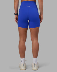 Woman wearing Elixir Ultra High-Rise 6" Short Pockets - Power Cobalt | Model:Keisha | Size:S | Thumbnail Index: 3
