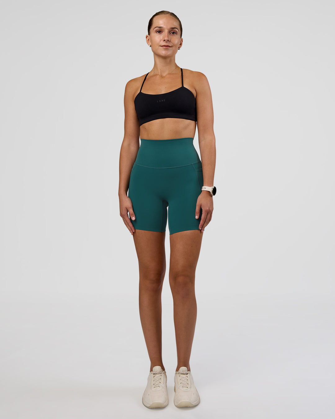Woman wearing Elixir Ultra High-Rise 6" Short Pockets - Transformative Teal | Model:Myrte | Size:S - view 3