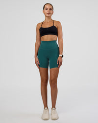Woman wearing Elixir Ultra High-Rise 6" Short Pockets - Transformative Teal | Model:Myrte | Size:S | Thumbnail Index: 2