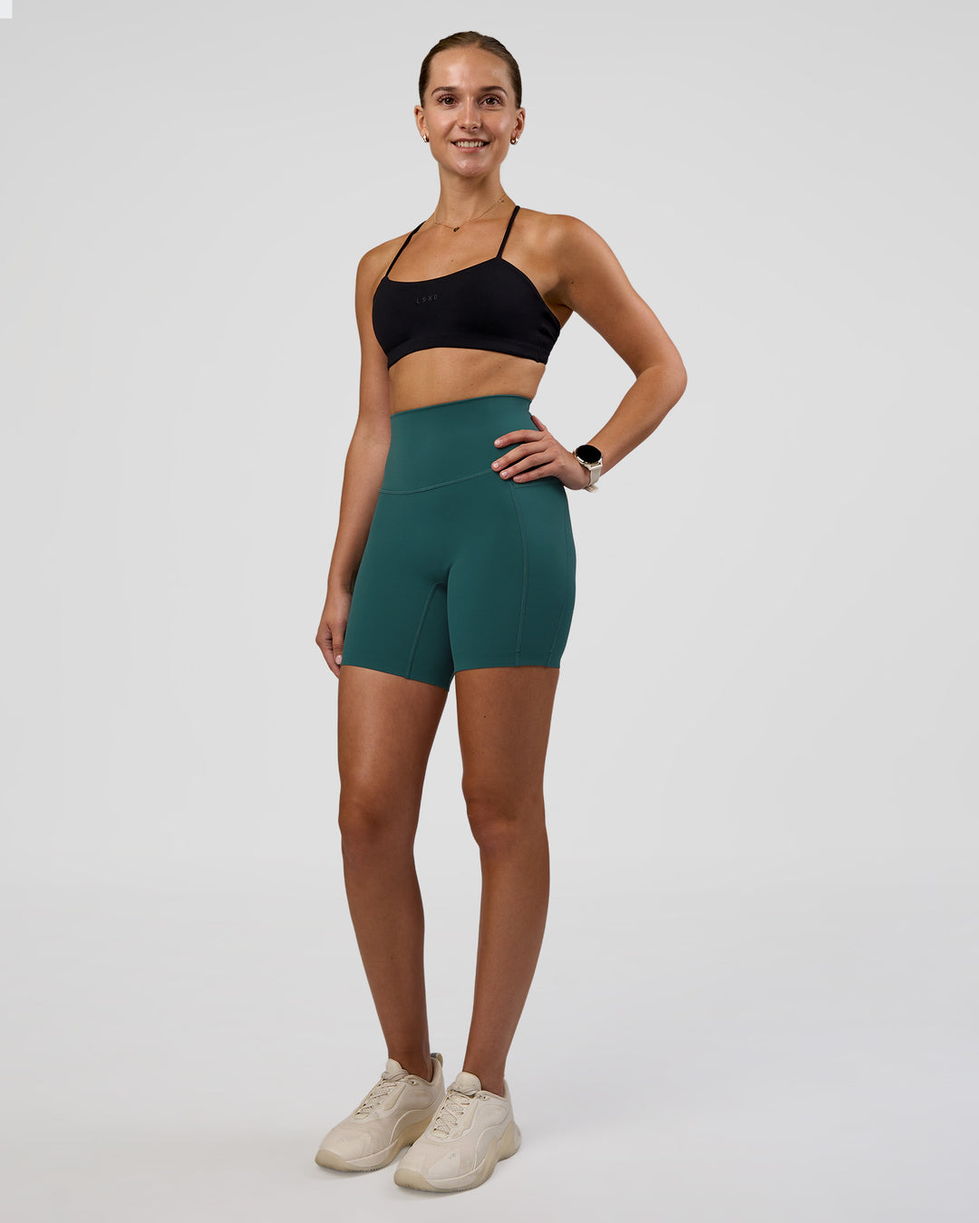Woman wearing Elixir Ultra High-Rise 6" Short Pockets - Transformative Teal | Model:Myrte | Size:S - view 5