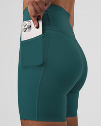 Woman wearing Elixir Ultra High-Rise 6" Short Pockets - Transformative Teal | Model:Myrte | Size:S | Thumbnail Index: 1