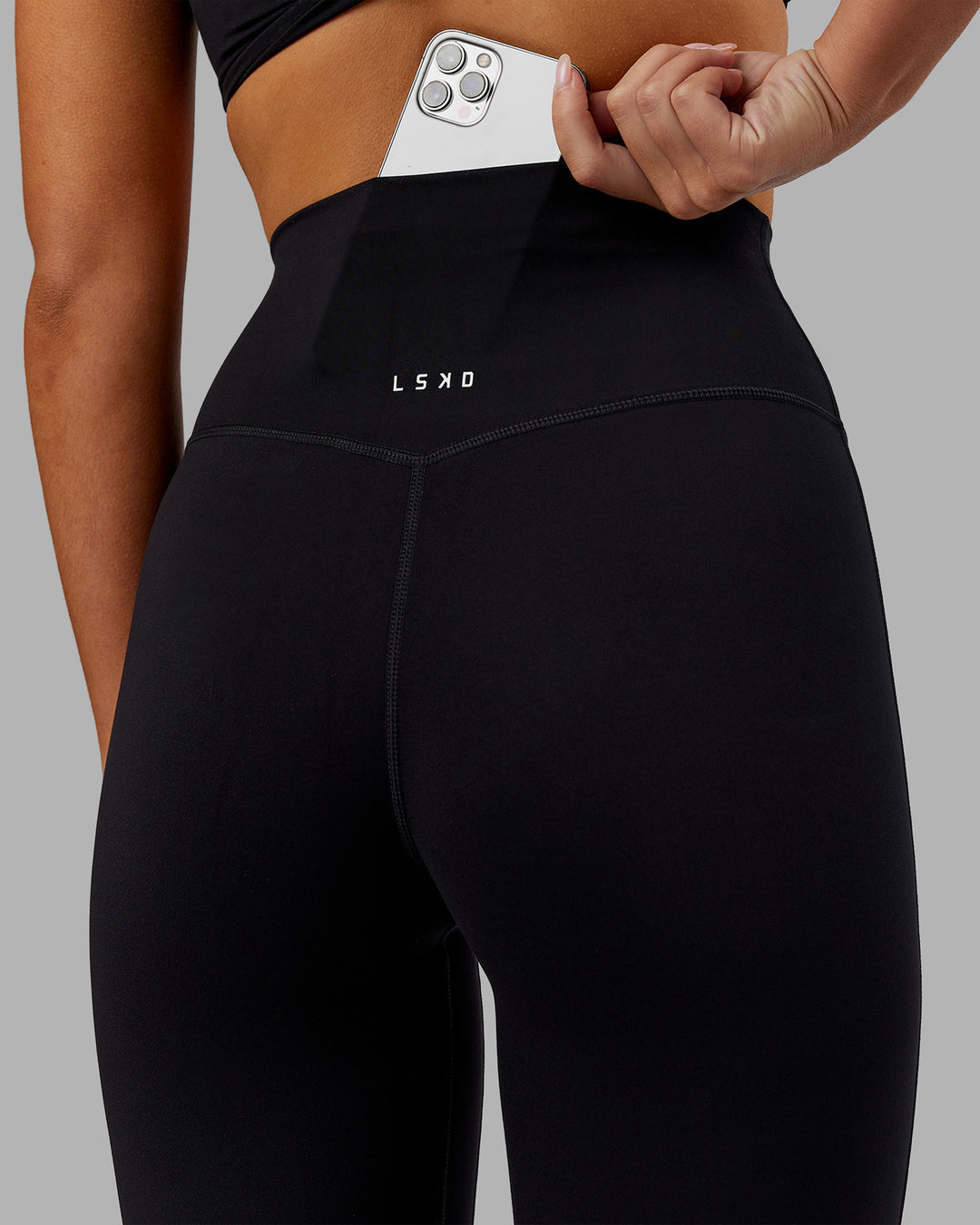 Woman wearing Elixir Ultra High-Rise 7/8 Legging - Black | Model:Kirstyn | Size:S - view 3