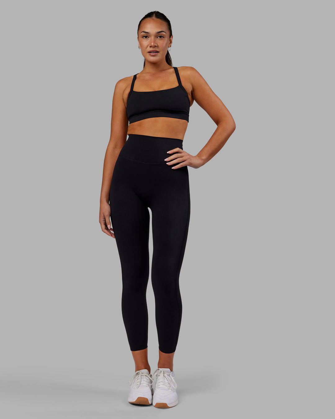 Woman wearing Elixir Ultra High-Rise 7/8 Legging - Black | Model:Kirstyn | Size:S - view 1