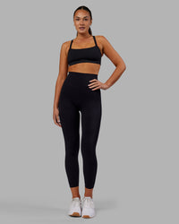 Woman wearing Elixir Ultra High-Rise 7/8 Legging - Black | Model:Kirstyn | Size:S | Thumbnail Index: 0