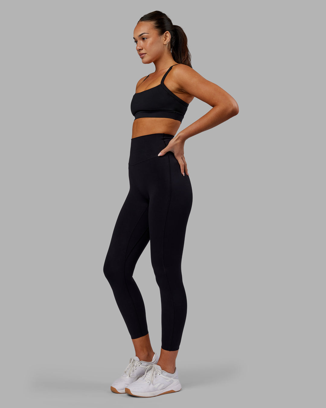 Woman wearing Elixir Ultra High-Rise 7/8 Legging - Black | Model:Kirstyn | Size:S - view 4