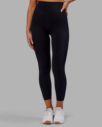 Woman wearing Elixir Ultra High-Rise 7/8 Legging - Black | Model:Kirstyn | Size:S | Thumbnail Index: 1