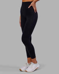 Woman wearing Elixir Ultra High-Rise 7/8 Legging - Black | Model:Kirstyn | Size:S | Thumbnail Index: 5