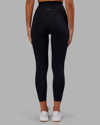 Woman wearing Elixir Ultra High-Rise 7/8 Legging - Black | Model:Kirstyn | Size:S | Thumbnail Index: 4