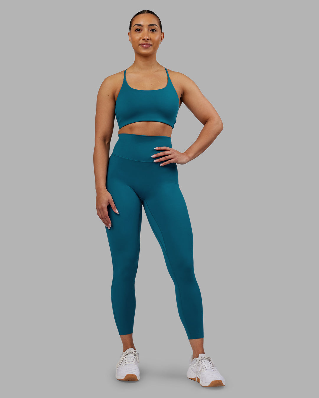Woman wearing Elixir Ultra High-Rise 7/8 Legging - Blue Coral | Model:Ayla | Size:S - view 1