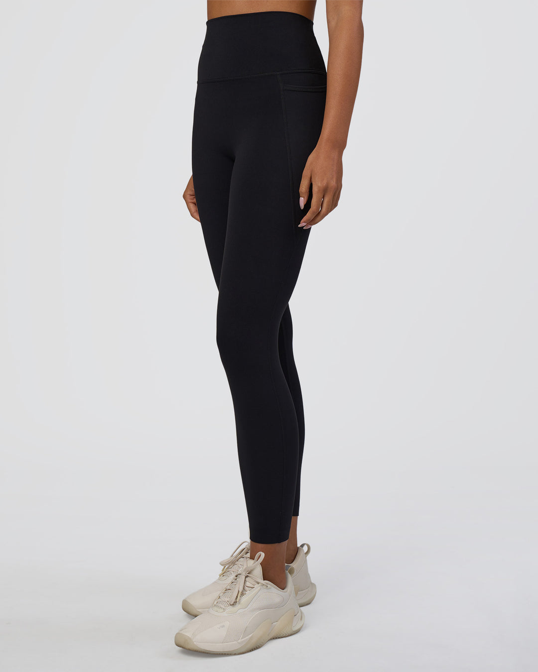 Woman wearing Elixir Ultra High-Rise 7/8 Legging Pockets - Black | Model:Ruby | Size:S - view 1