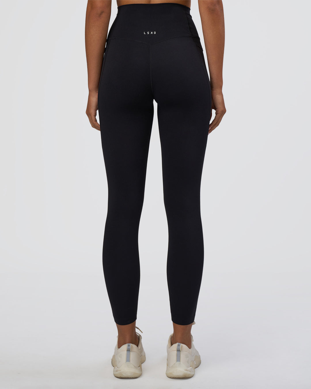 Woman wearing Elixir Ultra High-Rise 7/8 Legging Pockets - Black | Model:Ruby | Size:S - view 4