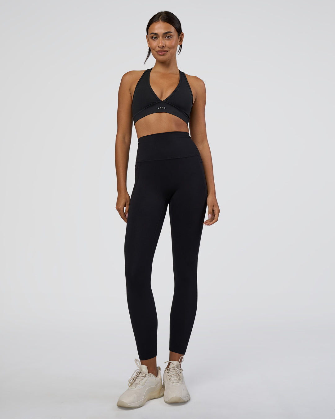 Woman wearing Elixir Ultra High-Rise 7/8 Legging Pockets - Black | Model:Ruby | Size:S - view 5