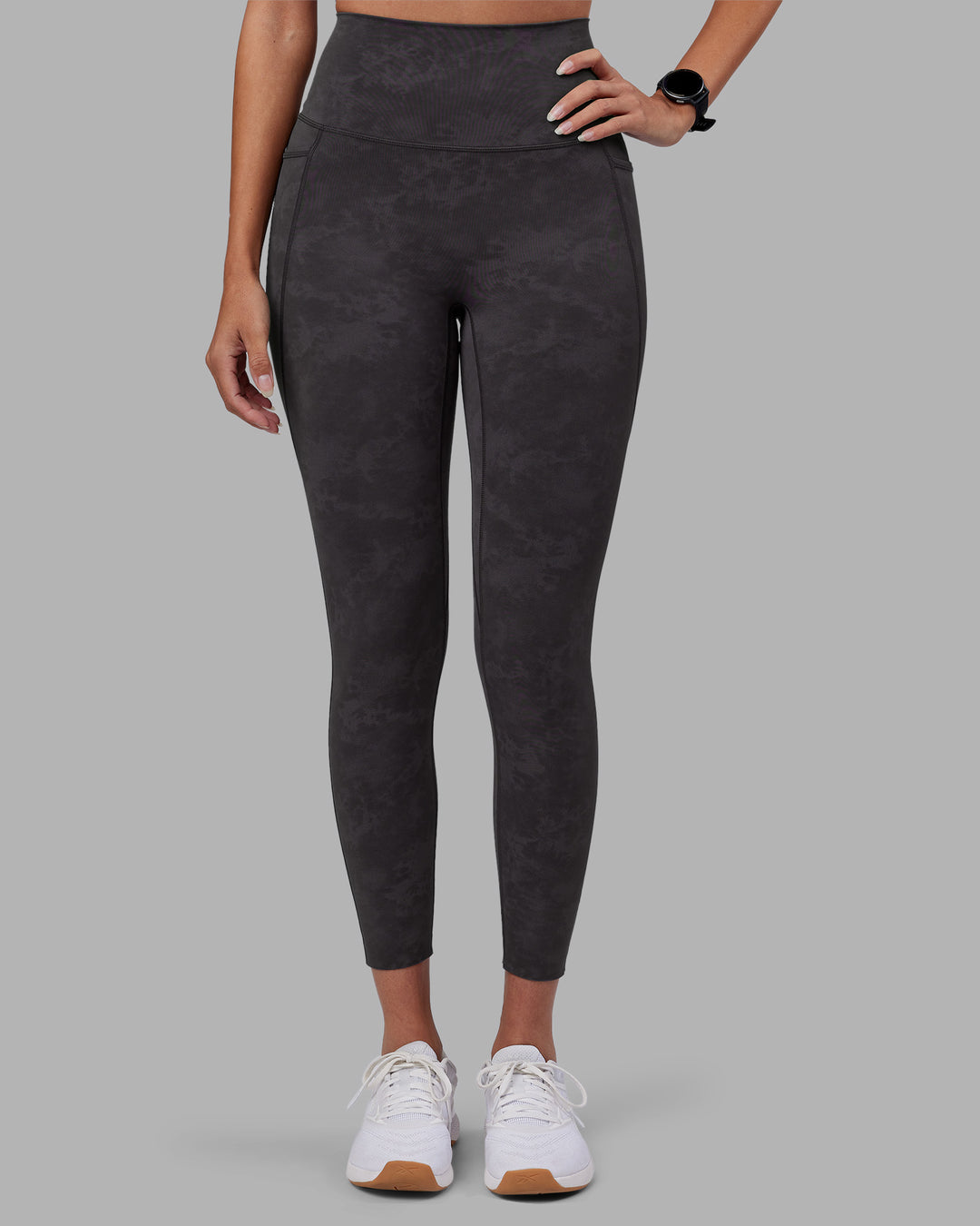 Woman wearing Elixir Ultra High-Rise 7/8 Legging Pockets - Dark Storm Wash | Model:Rhiley | Size:S - view 2