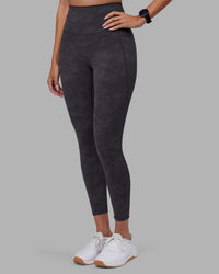 Woman wearing Elixir Ultra High-Rise 7/8 Legging Pockets - Dark Storm Wash | Model:Rhiley | Size:S | Thumbnail Index: 5