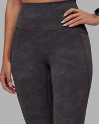 Woman wearing Elixir Ultra High-Rise 7/8 Legging Pockets - Dark Storm Wash | Model:Rhiley | Size:S | Thumbnail Index: 6