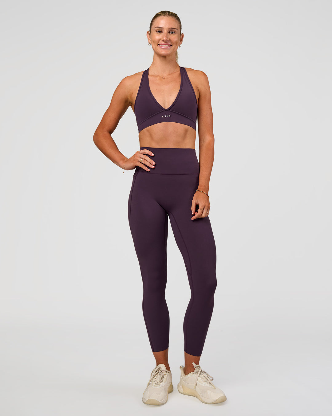 Woman wearing Elixir Ultra High-Rise 7/8 Legging Pockets - Midnight Plum | Model:Emelia | Size:S - view 10