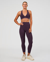 Woman wearing Elixir Ultra High-Rise 7/8 Legging Pockets - Midnight Plum | Model:Emelia | Size:S | Thumbnail Index: 9