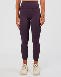 Woman wearing Elixir Ultra High-Rise 7/8 Legging Pockets - Midnight Plum | Model:Emelia | Size:S | Thumbnail Index: 5