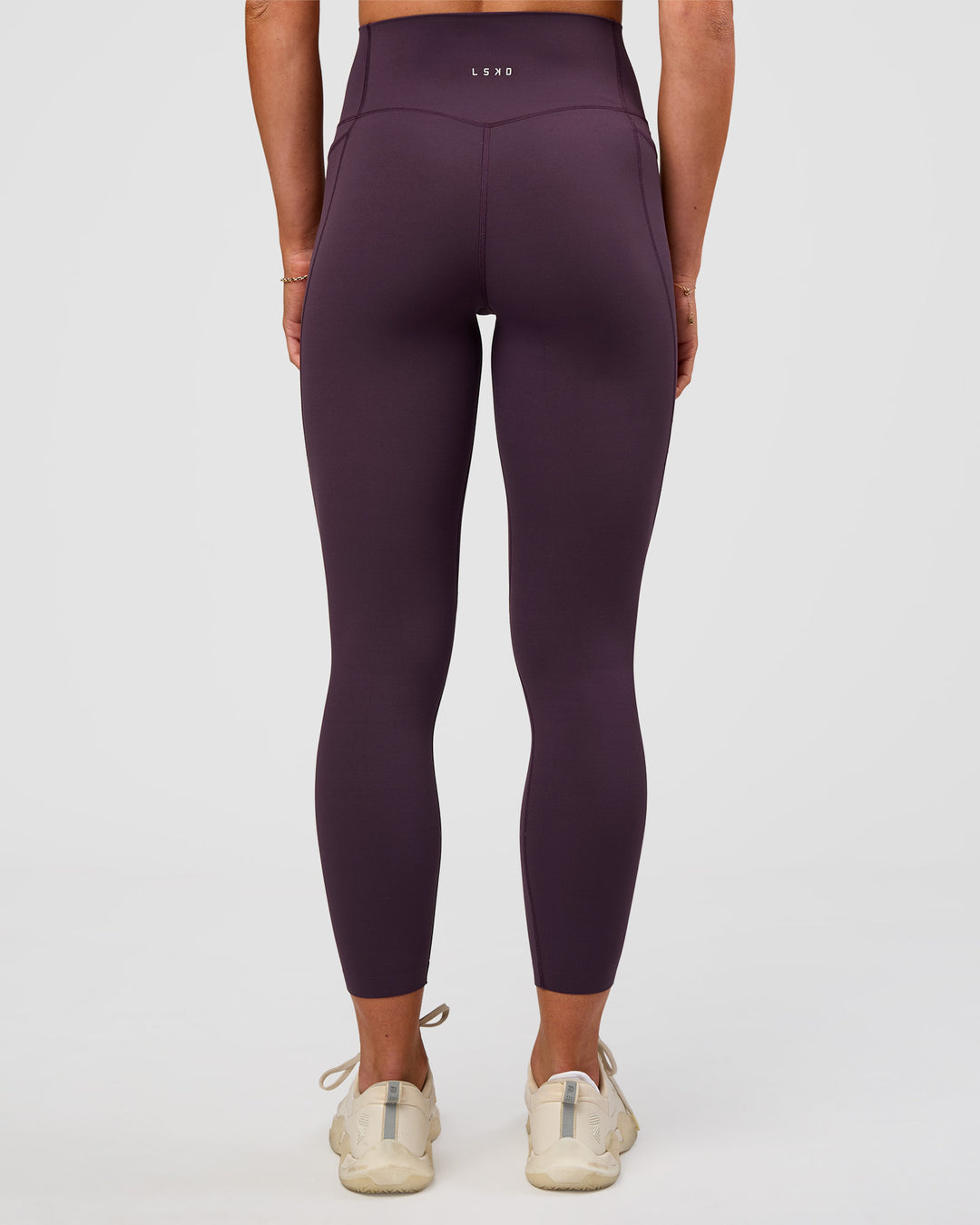 Woman wearing Elixir Ultra High-Rise 7/8 Legging Pockets - Midnight Plum | Model:Emelia | Size:S - view 3