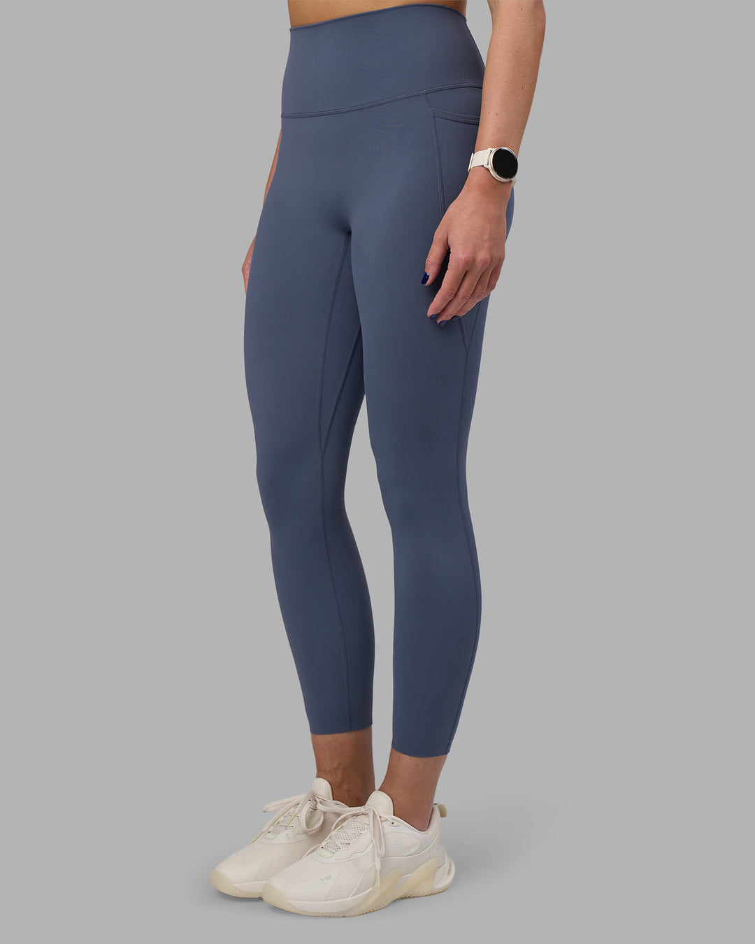 Woman wearing Elixir Ultra High-Rise 7/8 Legging Pockets - Night Shadow | Model:Phoebe | Size:S - view 1