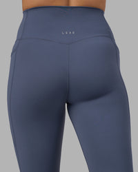 Woman wearing Elixir Ultra High-Rise 7/8 Legging Pockets - Night Shadow | Model:Phoebe | Size:S | Thumbnail Index: 6