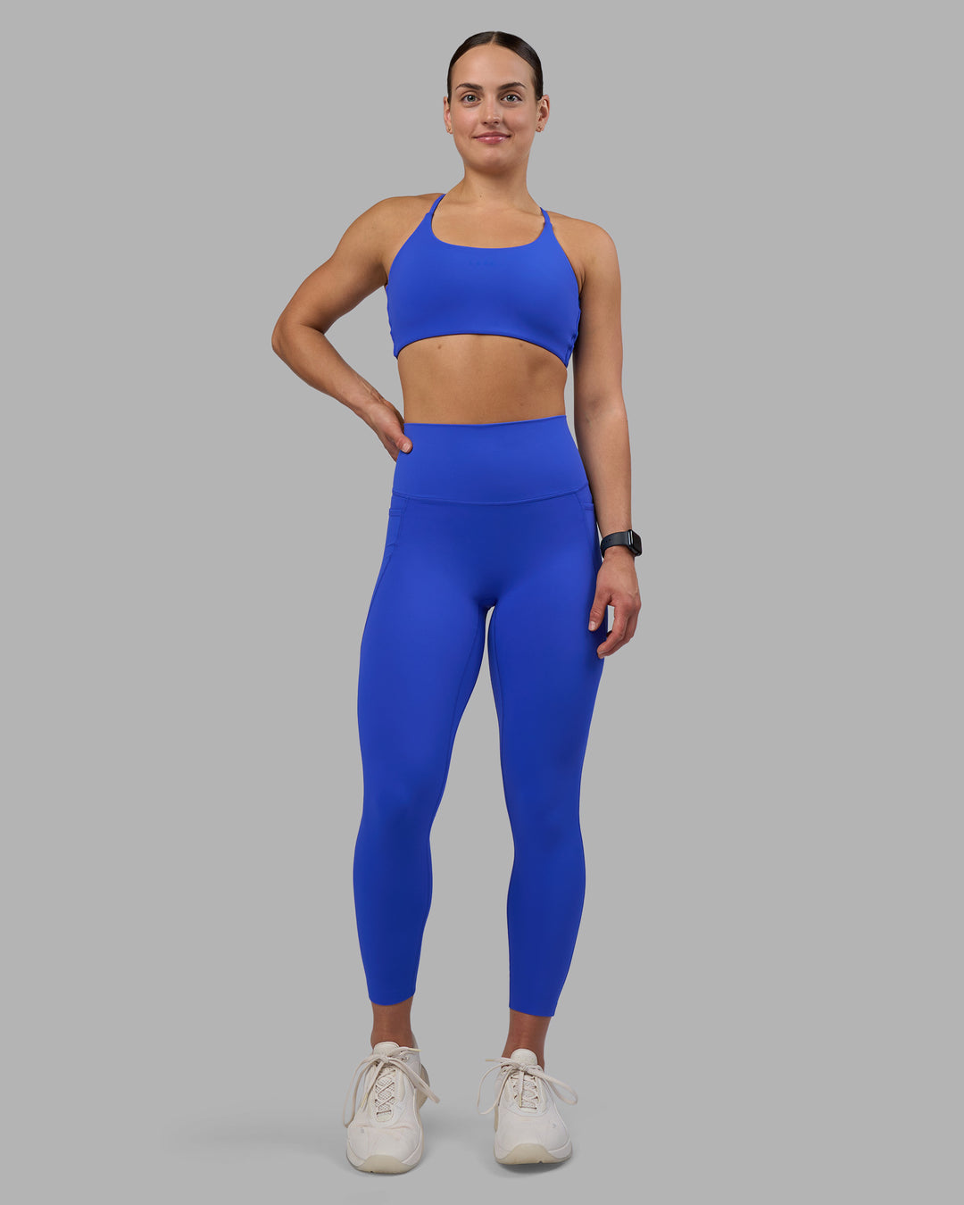 Woman wearing Elixir Ultra High-Rise 7/8 Legging Pockets - Power Cobalt | Model:Keisha | Size:S - view 2